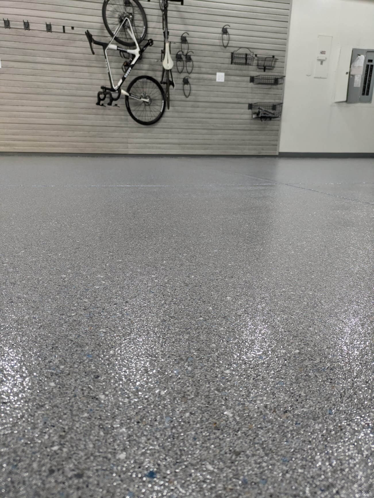 Polyaspartic chip floor with slatwall storage